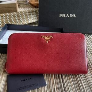 Prada red saffiano leather zip around wallet
